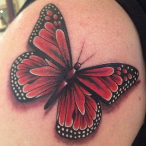 Pink monarch butterfly tattoo