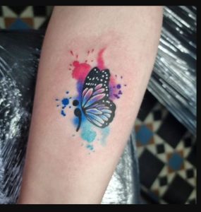 Semicolon Butterfly Tattoo with a Burst of Color ideas designs