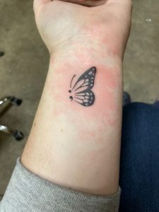 butterfly-and-semicolon-tattoo-on-girls-hand