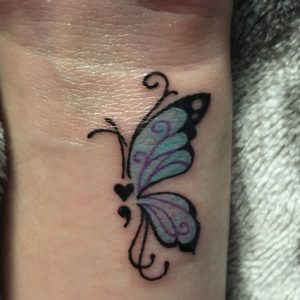wrist butterfly semicolon tattoo