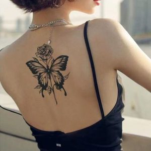 Black Butterfly Tattoo on White Skin