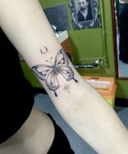 Black Butterfly Tattoo on White Skin Designs