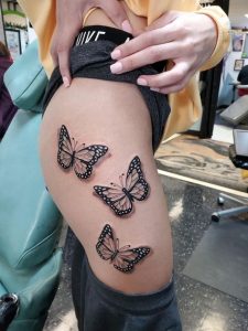 Black butterfly Tattoo on Thigh ideas