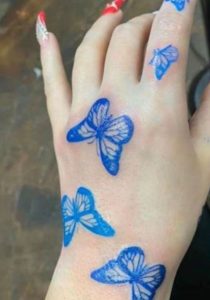 Blue-hand-butterfly-tattoo