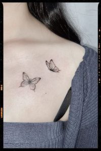 Feminine White Butterfly Tattoo