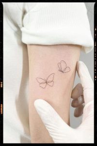 Feminine White Butterfly Tattoo designs