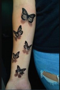 best-balck-butterfly-hand-tattoo