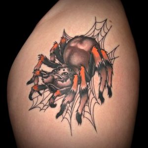 black-and-yellow-traditional-spider-tattoo-bicep