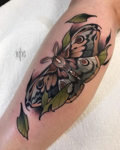 green-and-black-moth-tattoo