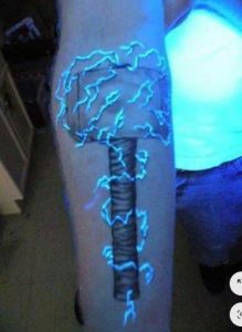 Glow-in-the-Dark Tattoos on arm