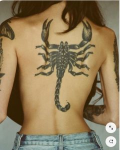 scorpion tattoo along with spine