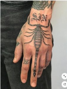 tattoo scorpion on hand