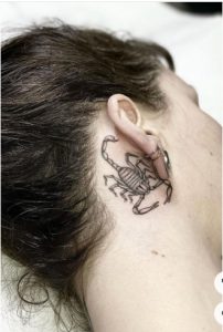 simple scorpion besign behind ear