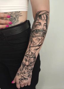 Feminine floral sleeve tattoo