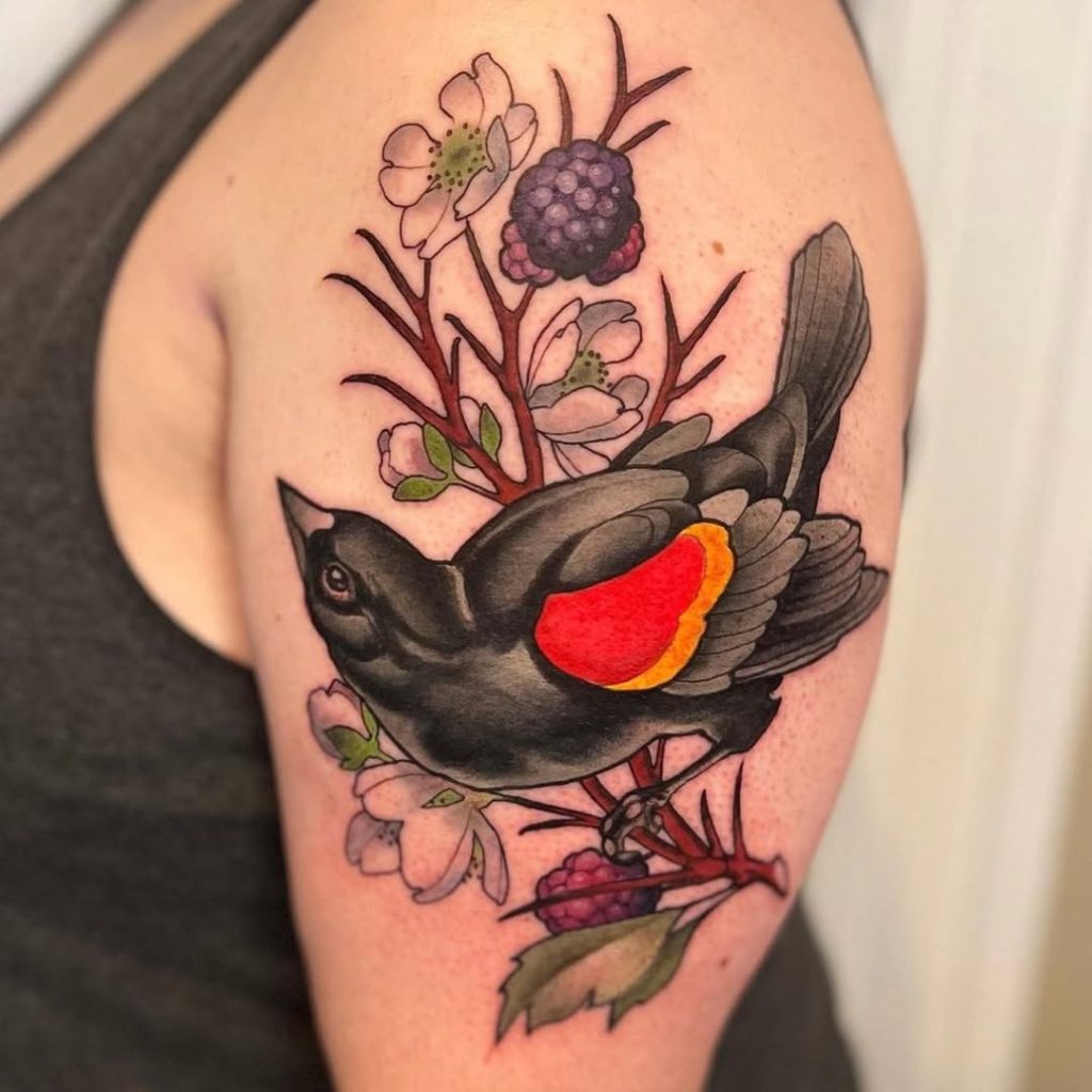 blackbird with flowers shoulder tattoo
